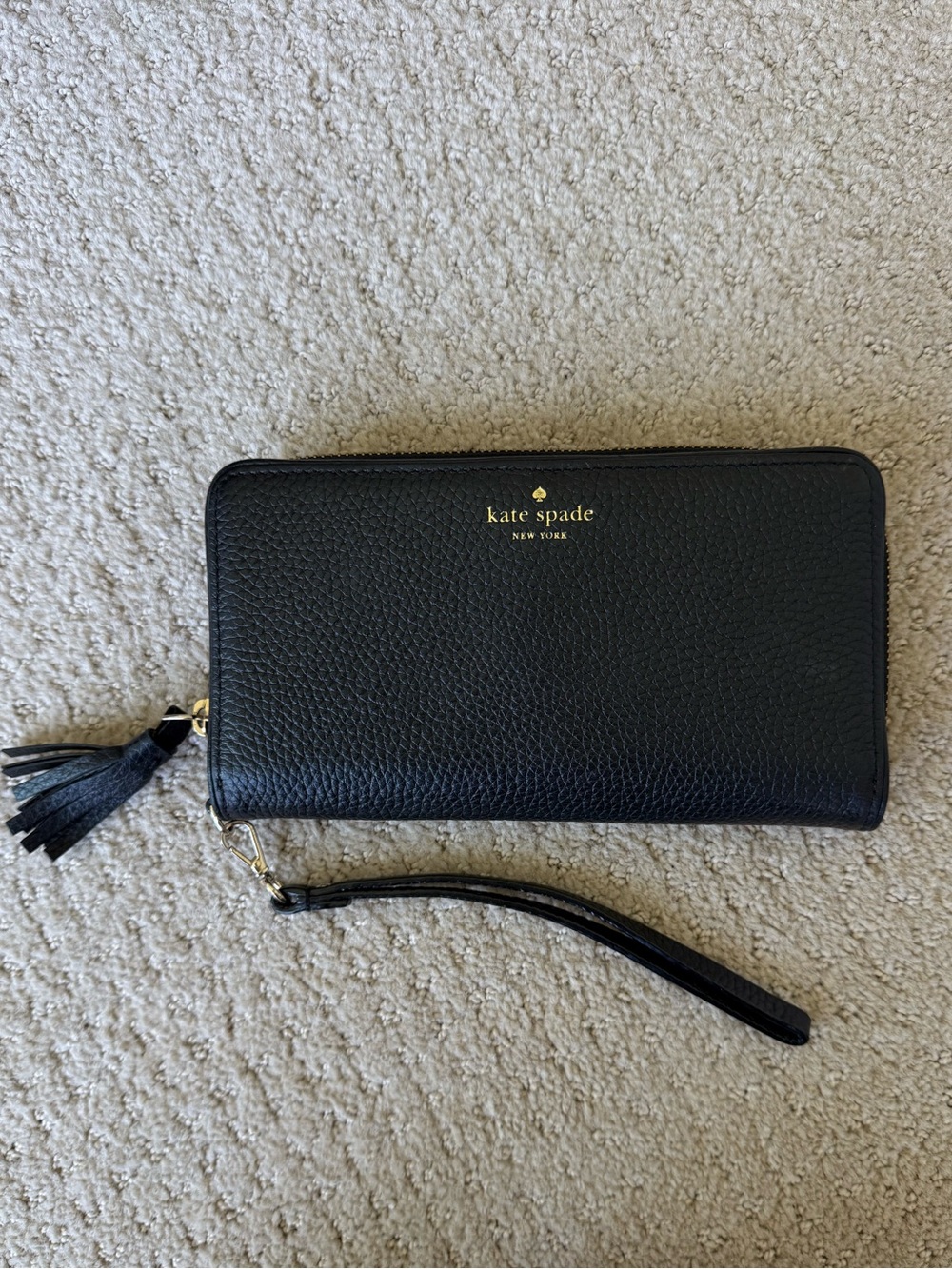 kate spade Black Pebbled Leather Zip-Around Wristlet with Tassel